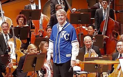 Kansas City Symphony music director Michael Stern wears a Royals jersey over his concert tuxedo (YouTube screenshot)