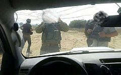IDF soldiers at the scene of a shooting attack against an Israeli vehicle near the border with the Gaza Strip on Sunday, October 11, 2015 (courtesy)