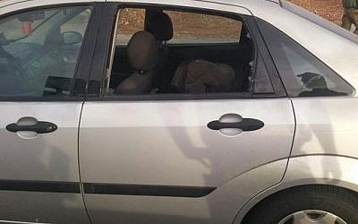 An Israeli car hit by a firebomb near the settlement of Beit El, north of Jerusalem. A mother and her two daughters were wounded in the incident on October 23, 2015 (Courtesy IDF Spokesman) An Israeli car hit by a firebomb near the settlement of Beit El, north of Jerusalem. A mother and her two daughters were wounded in the incident on October 23, 2015 (Courtesy IDF Spokesman)