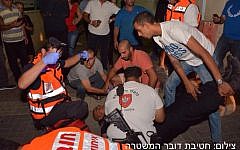 Medics working on a soldier who was stabbed in Afula on October 8, 2015. (Police spokesperson)