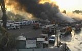 Smoke rises from the Dan bus terminal in Ramat Gan during a major fire at the site, October 17, 2015 (screencap from Ynet live feed)