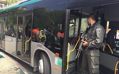 Police guarding a bus after terrorists opened fire and stabbed passengers in Jerusalem on October 13, 2015. (Courtesy Police)