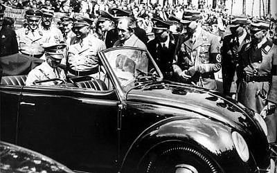 Adolf Hitler climbs into a Beetle at the Volkswagen factory in Wolfsburg in 1938 (Courtesy) Adolf Hitler climbs into a Beetle at the Volkswagen factory in Wolfsburg in 1938 (Courtesy)