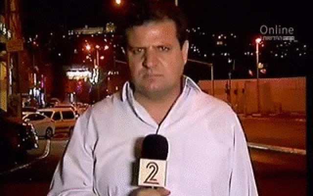 Joint (Arab) List leader Ayman Odeh is heckled by the mayor of Nazareth during an Channel 2 news interview (screen capture: Channel 2) Joint (Arab) List leader Ayman Odeh is heckled by the mayor of Nazareth during an Channel 2 news interview (screen capture: Channel 2)