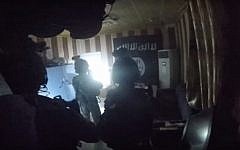 An image from a video purportedly showing a joint US-Kurdish raid on an Islamic State prison in the town of Hawija, Iraq on October 22, 2015. (screen shot: YouTube)