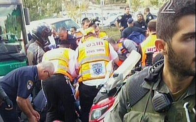 Police and medics at the scene of a stabbing attack in Jerusalem on Thursday, October 8, 2015 (screen capture: Channel 2)