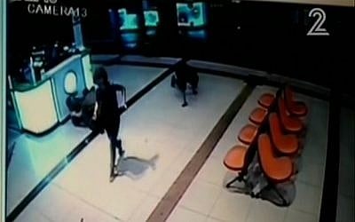 Security camera footage showing an alleged attacker crawling in the Beersheba central bus station on October 18, 2015. (screen capture: Channel 2) Security camera footage showing an alleged attacker crawling in the Beersheba central bus station on October 18, 2015. (screen capture: Channel 2)