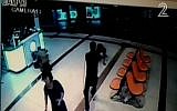 Security camera footage showing an Eritrean man being shot in the Beersheba central bus station on October 18, 2015, after he was thought to be a terrorist. (screen capture: Channel 2)
