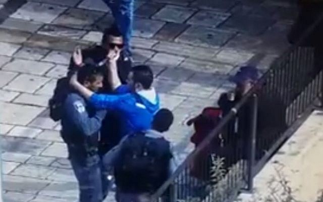 A screen capture from security footage showing a man trying to stab a police officer outside Jerusalem's Old City on October 12, 2015. A screen capture from security footage showing a man trying to stab a police officer outside Jerusalem's Old City on October 12, 2015.
