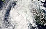 This satellite image taken at 1:30 p.m. EDT on Friday, October 23, 2015, and released by NASA, shows the eastern quadrant and pinhole eye of Hurricane Patricia moving towards southwestern Mexico. (Goddard MODIS Rapid Response Team/NASA via AP)
