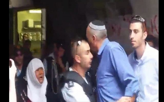 Jewish Home MK Moti Yogev seen yelling an an Arab woman in Jerusalem's Old City on October 6, 2015. (screen grab: Channel 2) Jewish Home MK Moti Yogev seen yelling an an Arab woman in Jerusalem's Old City on October 6, 2015. (screen grab: Channel 2)