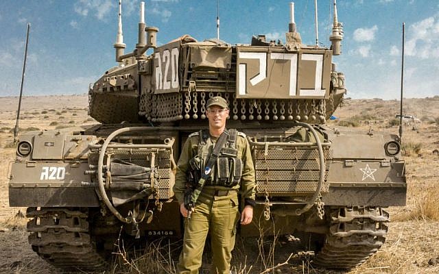 Commander of the 188th Armored Brigade Col. Nir Ben-David stands in front of his tank during an exercise in the Golan Heights on Oct. 19, 2015. (IDF Spokesperson's Unit)