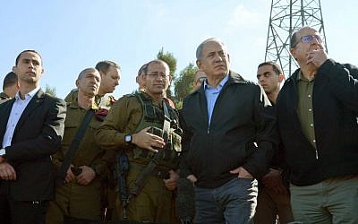 Prime Minister Benjamin Netanyahu and Defense Minister Moshe Ya'alon visit the Gush Etzion Junction on Monday, November 23, 2015. (GPO)