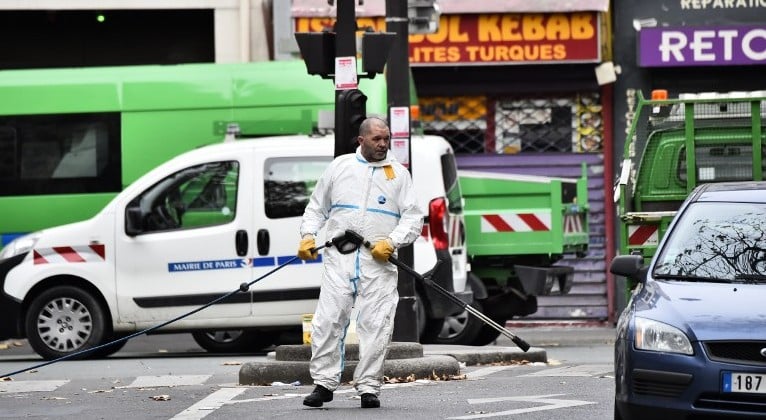 A crime scene cleaner is pictured at the Rue de Charonne in Paris on November 14, 2015, following a series of coordinated attacks in and around Paris late Friday that left at least 127 people dead. (AFP PHOTO/LOIC VENANCE) A crime scene cleaner is pictured at the Rue de Charonne in Paris on November 14, 2015, following a series of coordinated attacks in and around Paris late Friday that left at least 127 people dead. (AFP PHOTO/LOIC VENANCE)