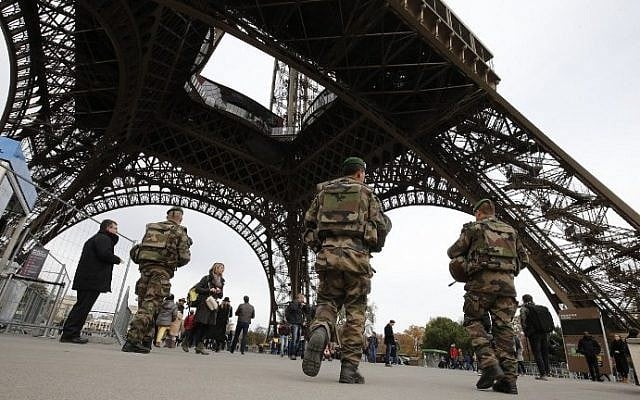 French soldiers patrol the area at the foot of the Eiffel Tower in Paris on November 14, 2015, following a series of coordinated attacks in and around Paris that left more than 120 people dead. (AFP/Francois Guillot) French soldiers patrol the area at the foot of the Eiffel Tower in Paris on November 14, 2015, following a series of coordinated attacks in and around Paris that left more than 120 people dead. (AFP/Francois Guillot)