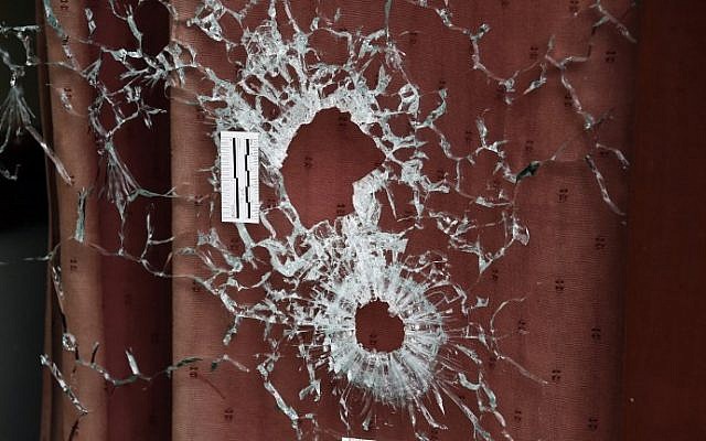Bullet holes scar the windows of the Carillon and the adjacent Cambodian restaurant on Rue Alibert in the 10th district, of the French capital Paris, on November 14, 2015, the morning after an attack which killed 12 people at the restaurant. (AFP PHOTO / DOMINIQUE FAGET) Bullet holes scar the windows of the Carillon and the adjacent Cambodian restaurant on Rue Alibert in the 10th district, of the French capital Paris, on November 14, 2015, the morning after an attack which killed 12 people at the restaurant. (AFP PHOTO / DOMINIQUE FAGET)