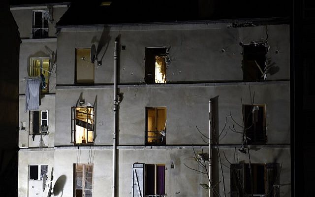 Picture taken of the building in the northern Paris suburb of Saint-Denis, on November 18, 2015, where French Police special forces raided an apartment, hunting those behind the attacks that claimed 129 lives in the French capital five days ago. (AFP/ERIC FEFERBERG)