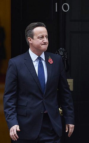 British Prime Minister David Cameron is pictured outside 10 Downing Street in London on November 3, 2015, as he waits to greet President Nursultan Nazarbayev of Kazakhstan. (AFP PHOTO / NIKLAS HALLE'N)
