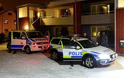Illustrative: Swedish police stand by police cars outside a house in Boliden in northeastern Sweden on November 19, 2015. (AFP/TT News Agency/Robert Granstrom)