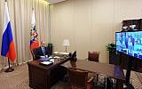 Russian President Vladimir Putin holds a video conference with top military officials on Russia's Air Forces' operation in Syria at the Novo-Ogaryovo residence outside Moscow on November 20, 2015. (AFP/SPUTNIK/MIKHAIL KLIMENTYEV)