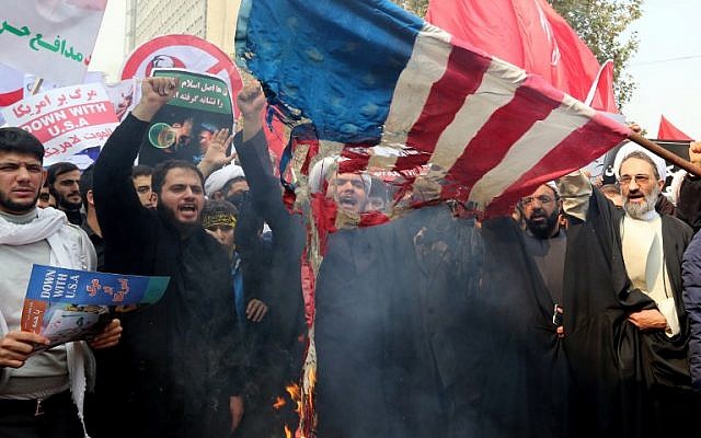 Iranians burn a US flag outside the former US embassy in the Iranian capital Tehran during a demonstration marking the anniversary of its storming by student protesters that triggered a hostage crisis in 1979, November 4, 2015. (Photo by AFP Photo / Atta Kenare)