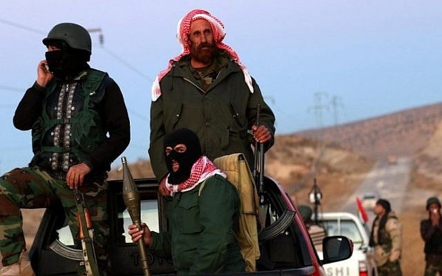 Iraqi Kurdish forces take part in an operation backed by US-led strikes in the northern Iraqi town of Sinjar on November 12, 2015, to retake the town from the Islamic State group and cut a key supply line to Syria. (AFP PHOTO / SAFIN HAMED) Iraqi Kurdish forces take part in an operation backed by US-led strikes in the northern Iraqi town of Sinjar on November 12, 2015, to retake the town from the Islamic State group and cut a key supply line to Syria. (AFP PHOTO / SAFIN HAMED)