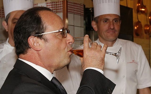 French President Francois Hollande drinks a glass of cider during a visit to Le Mont-Saint-Michel, on October 31, 2015. (AFP/Pool/Stephane Mahe) French President Francois Hollande drinks a glass of cider during a visit to Le Mont-Saint-Michel, on October 31, 2015. (AFP/Pool/Stephane Mahe)