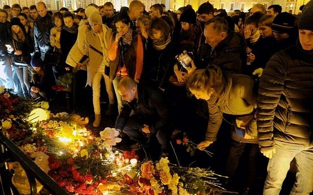 People light candles and place flowers in central Saint Petersburg on November 1, 2015, in memory of the victims of a jetliner crash. (AFP/ OLGA MALTSEVA) People light candles and place flowers in central Saint Petersburg on November 1, 2015, in memory of the victims of a jetliner crash. (AFP/ OLGA MALTSEVA)