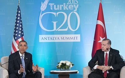 US President Barack Obama speaks as Turkish President Recep Tayyip Erdogan looks on during a meeting on the sidelines of the G20 summit in Antalya, Turkey, November 15, 2015. (Photo by AFP Photo / Sauk Loeb)