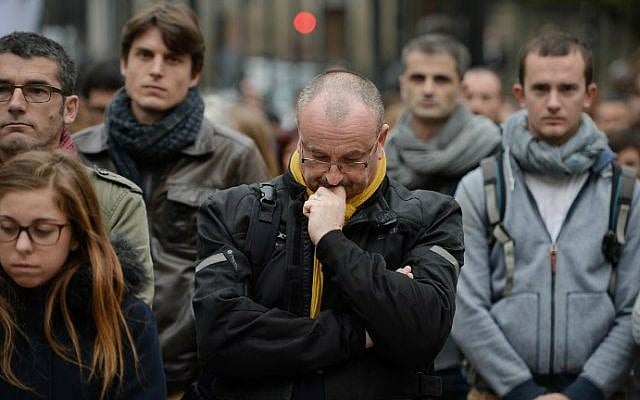 People observe a minute of silence on November 16, 2015 at the city hall of Nantes, western France to pay tribute to victims of the attacks claimed by Islamic State which killed at least 129 people and left more than 350 injured on November 13 in Paris. (AFP Photo/Jean-Sebastien Evrard) People observe a minute of silence on November 16, 2015 at the city hall of Nantes, western France to pay tribute to victims of the attacks claimed by Islamic State which killed at least 129 people and left more than 350 injured on November 13 in Paris. (AFP Photo/Jean-Sebastien Evrard)