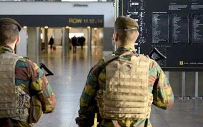 Military police soldiers patrol the Brussels Airport on November 18, 2015 in Zaventem, eastern Brussels following a series of coordinated attacks by Islamic State jihadists in Paris on November 13 that killed at least 129 people. (AFP PHOTO / BELGA / DIRK WAEM / AFP / BELGA / DIRK WAEM)