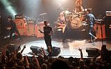 American rock group Eagles of Death Metal performing on stage at the Bataclan concert hall in Paris, France, a few moments before terrorists stormed into the venue and massacred 89 people, November 13, 2015. (AFP/ROCK&FOLK/Marion Ruszniewski)