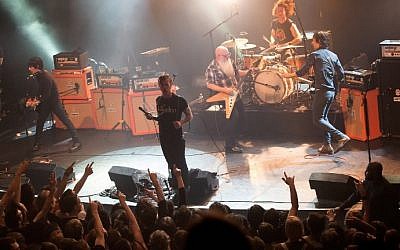 American rock group Eagles of Death Metal performing on stage at the Bataclan concert hall in Paris, France, a few moments before terrorists stormed into the venue and massacred 89 people, November 13, 2015. (AFP/ROCK&FOLK/Marion Ruszniewski)