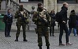 Belgian soldiers stand at the Grand Place in Brussels on November 22, 2015. (AFP Photo/John Thys)