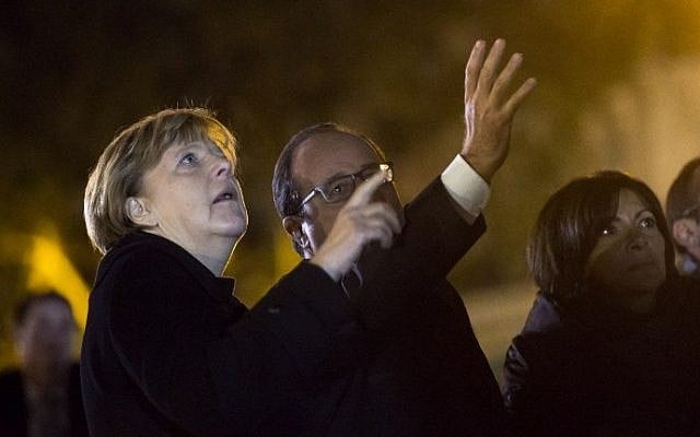 German Chancellor Angela Merkel (L) and French President Francois Hollande gesture as they pay their respects to the victims of the November 13 Paris attacks on November 25, 2015, on the Place de la Republique in Paris, where they each left a white rose. (Etienne Laurent/AFP/) German Chancellor Angela Merkel (L) and French President Francois Hollande gesture as they pay their respects to the victims of the November 13 Paris attacks on November 25, 2015, on the Place de la Republique in Paris, where they each left a white rose. (Etienne Laurent/AFP/)