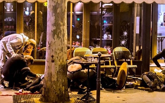 People lie on the pavement at Cafe Bonne Biere in Paris, on November 13, 2015, following a series of coordinated attacks in and around Paris which left more than 120 people dead. (AFP PHOTO / ANTHONY DORFMANN) People lie on the pavement at Cafe Bonne Biere in Paris, on November 13, 2015, following a series of coordinated attacks in and around Paris which left more than 120 people dead. (AFP PHOTO / ANTHONY DORFMANN)