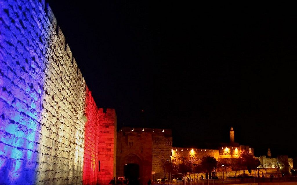 Jerusalem's Old City Walls are illuminated in red, white and blue, the colors of the French flag, in Jerusalem, November 15, 2015. (Photo by AFP Photo / Gali Tibbon)