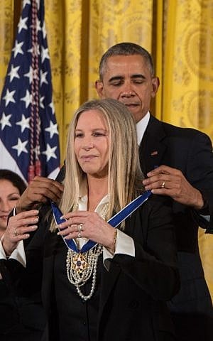 US President Barack Obama presents the Presidential Medal of Freedom to singer and actress Barbra Streisand at the White House, Washington, November 24, 2015. (AFP/NICHOLAS KAMM) US President Barack Obama presents the Presidential Medal of Freedom to singer and actress Barbra Streisand at the White House, Washington, November 24, 2015. (AFP/NICHOLAS KAMM)