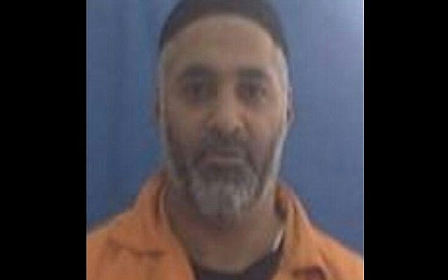 Convicted murderer Yaron Sanker, who escaped from Prison Service guards on Sunday, November 15, 2015, and led police on a nationwide manhunt before being captured early the next morning. (Israel Prison Service) Convicted murderer Yaron Sanker, who escaped from Prison Service guards on Sunday, November 15, 2015, and led police on a nationwide manhunt before being captured early the next morning. (Israel Prison Service)