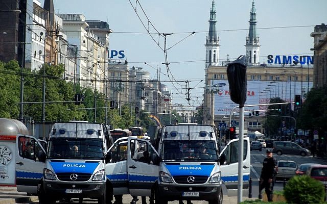 Illustrative photo of police forces in Warsaw, Poland (photo credit: CC BY Piotr Drabik, Flikr)