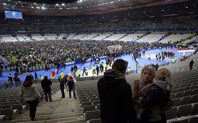 Supporters invade the pitch of the Stade de France stadium at the end of the international friendly soccer match between France and Germany in Saint Denis, outside Paris, November 13, 2015. (AP/Christophe Ena) Supporters invade the pitch of the Stade de France stadium at the end of the international friendly soccer match between France and Germany in Saint Denis, outside Paris, November 13, 2015. (AP/Christophe Ena)