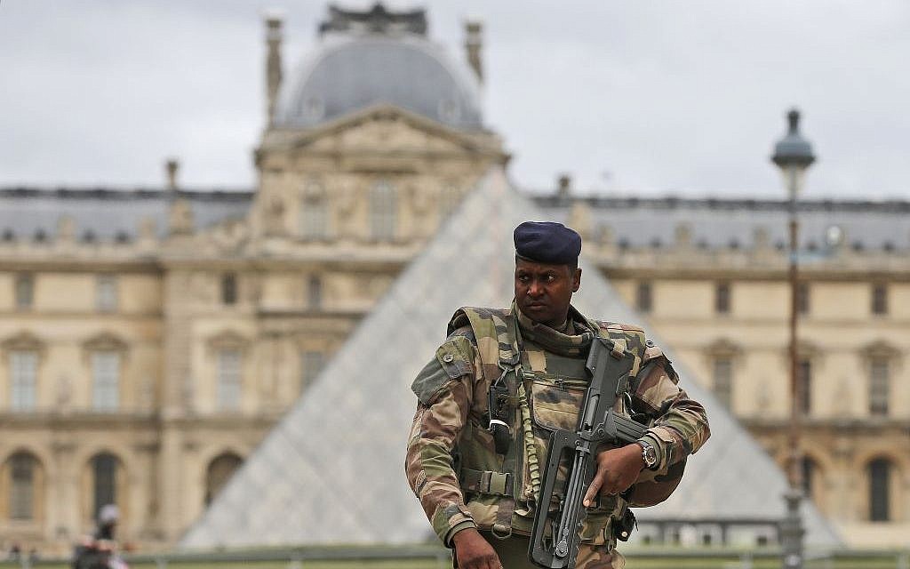 A soldier patrols in the courtyard of the Louvre Museum in Paris, Tuesday, November 17, 2015. (AP/Frank Augstein)