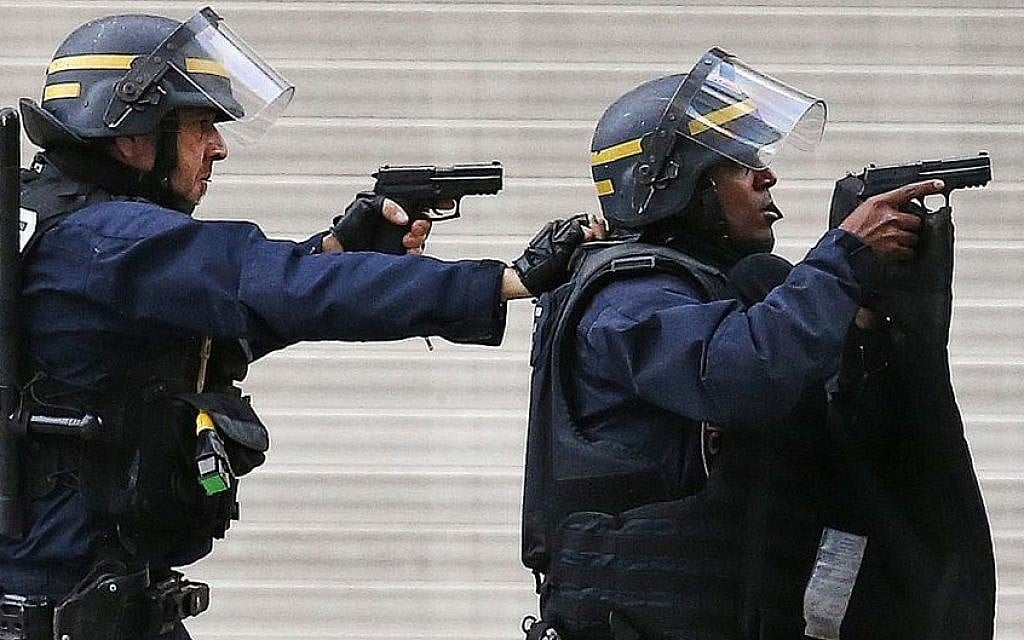 Police forces operate in Saint-Denis, a northern suburb of Paris, Wednesday, Nov. 18, 2015. (AP/Francois Mori)