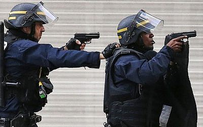 Police forces operate in Saint-Denis, a northern suburb of Paris, Wednesday, Nov. 18, 2015. (AP/Francois Mori)
