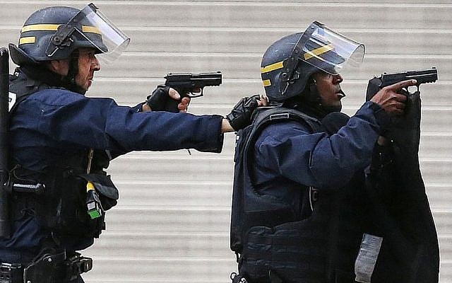 Police forces operate in Saint-Denis, a northern suburb of Paris, Wednesday, Nov. 18, 2015. (AP/Francois Mori) Police forces operate in Saint-Denis, a northern suburb of Paris, Wednesday, Nov. 18, 2015. (AP/Francois Mori)