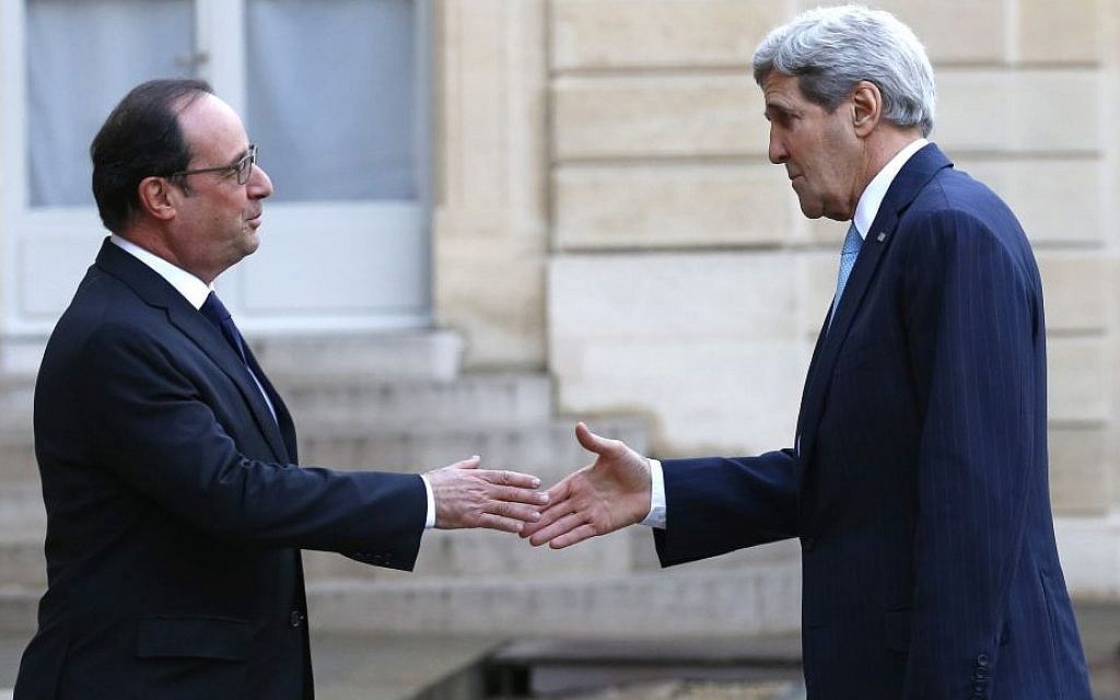 French President Francois Hollande, left, welcomes US Secretary of State John Kerry upon arrival at the Elysee Palace, in Paris, France, Tuesday, November 17, 2015. (AP/Francois Mori)