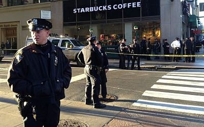 Illustrative: New York Police Department officers investigate a shooting at 35th Street and Eighth Avenue, Monday, Nov. 9, 2015, in New York. (AP Photo/Mark Lennihan)