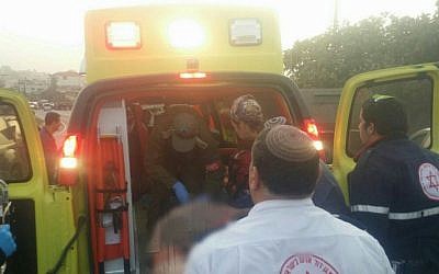 An injured Israeli man being taken by ambulance to a hospital in Jerusalem following a suspected car-ramming attack near Hebron, November 4, 2015. (Magen David Adom)