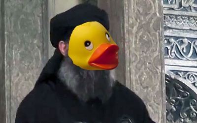 A photoshopped image of Islamic State leader Abu Bakr al-Baghdadi with the face of a rubber duckie posted on 4chan. (via Imgur)