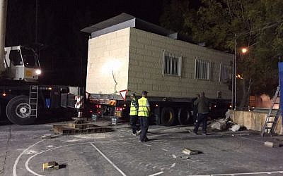The Defense Ministry delivers a series of trailers to the Givat Ze'ev settlement on Nov. 16, 2015. The structures will serve as a temporary replacement for an illegally built synagogue, which is slated for demolition, until a permanent building can be constructed. (Defense Ministry's Operations Department)